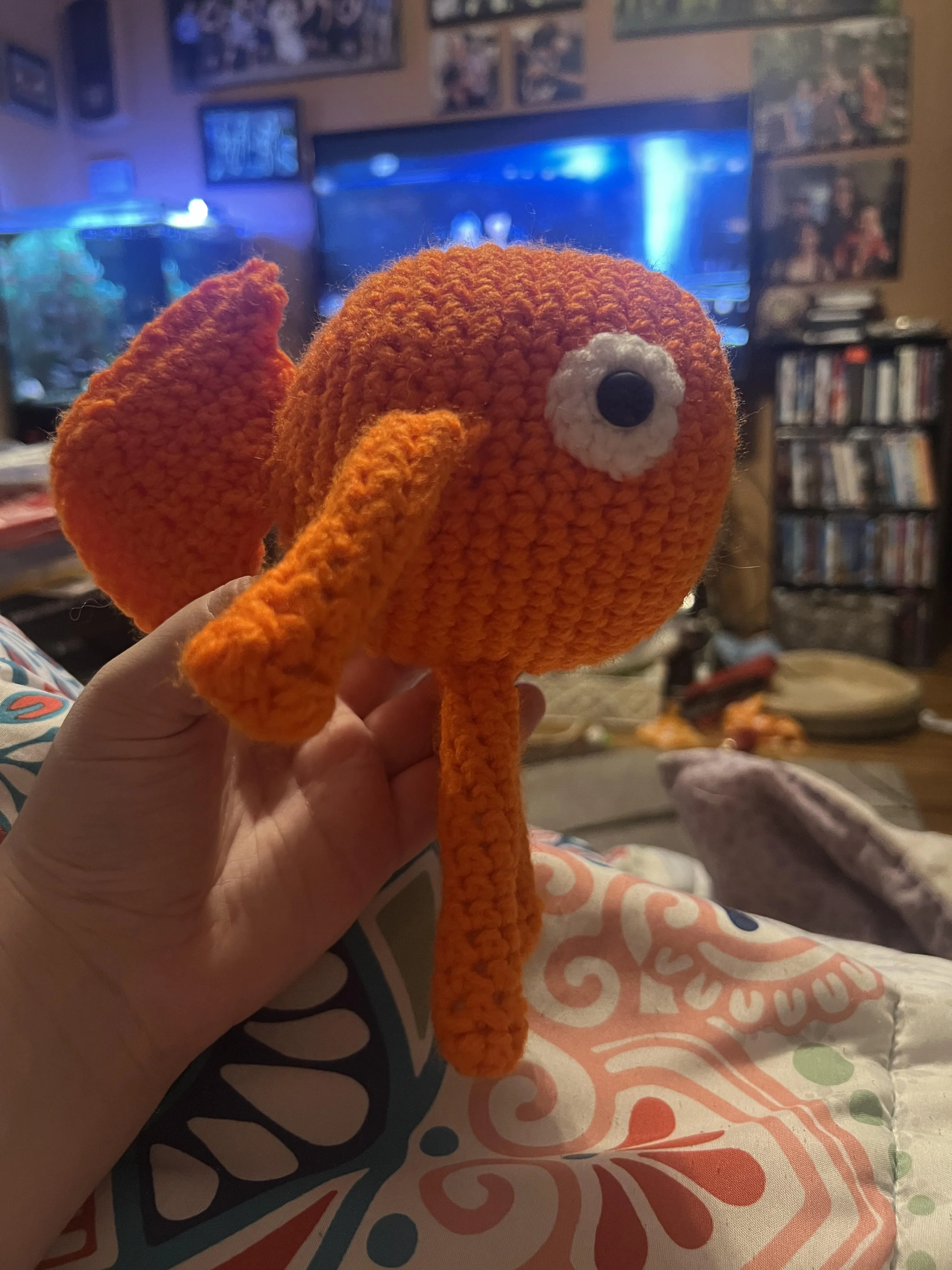 Orange fish with arms and legs side profile